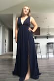 This dress fits perfectly around the bust area and I love the deep V on both the front and the back. The slit is also great and not too high, and I love the navy color. Only complaint is that the length is way too long (see photo), it'll be dragging on the floor even with heels. I'll just take it to a seamstress to get hemmed. - Devan D.