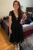 This dress really is beautiful. The lace is substantial and it feels great on. The waist has a small amount of give - fit perfectly on me. At a 34A, I figured this dress would be a bit big on top and I was right. The shoulders felt a bit saggy as a result. The sleeves also have a poofy structure that I didn't expect. I could probably make this work with the right adhesive bra, but I already have a few black lace dresses. Great dress otherwise, just couldn't justify the price with the fit on top! - Ava V.