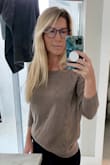 Love this sweater for Florida "fall" and is the loveliest taupe color. Also ordered in rust! Perfect to just throw on with a pair of jeans and go. Causal, classy & has fun detailing. Can't say how the fabric will hold up and isn't the softest material ever but I haven't washed them yet. I was hesitant to order the small since I usually order M or even L in sweaters but the other reviews were right about this sweater being slightly oversized. - LIZ G.