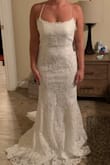 This dress is a stunner! It is long if you are short but that is to be expected. I love the back! I went up one dress size that I wear and ordered a 6!! - Shelby V.