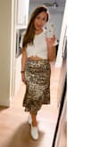 I am so happy with the fit and quality of this skirt! There is a tint of blue in person, but I personally love the touch of color. Easy to dress up or down. A must have skirt! - Judy V.