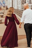 I wore this to my engagement photos and it photographed beautifully! The photographers loved it and the color was awesome! I little low cut and I'm quite chesty so that was a bit of an issue but otherwise perfect dress! - Shelby R.