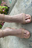 I love these shoes! Except, the first thing I had to do was put another hole in the very loose strap... and another, and another... With five extra holes on each side, I was able to get the strap tight around my ankle. I just slip the extra length underneath the ankle strap. With that done, these are great! The angle to the heel is unique, and I love the color tone. - LeAnne M.