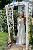 I'm planning to wear this dress for a summery wedding. I wanted something with flowery lace and an elegant trim, yet simple enough to not be "overdressed" for our big day. (My fiancé loves simple and sweet!)
The dress is elegant and I love how it's made. However, it's too long (will be altered) and a bit loose for me. Personally, it's a little heavy for me with three layers, but as long as it's not too hot, I'll be fine. 
Thank you Lulus for the gorgeous dress! Photo is attached when I first tried it on. - Hannah G.