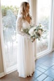 I got this dress for my elopement and the quality and detail of this dress was amazing! I did have to get it altered as it was too long for me and the waist was a little too big. But overall amazing dress and the back is to die for! - Krista M.