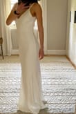 This dress is super flattering, I bought it to use for my micro-wedding. I'm just in love, it has linen, not transparent at all, classic and timeless - Fabi G.