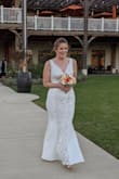 I bought this dress for our small, intimate fall wedding. After trying it on, I knew this was the perfect dress! I decided to have it altered as it was a little long even in heels, and I wanted to be comfortable walking around the day of our wedding. Given the inexpensive price of this dress, it was well worth the cost to have it altered, in my opinion. I also had the tailor add built-in cups so I didn't have to worry about a strapless bra or using tape. I'm not busty so the built-in cups also gave me some shape up top. Needless to say, I felt so beautiful and confident on the day of our wedding!! I received so many compliments from our family and friends, and they couldn't believe this was a $100 dress! - Adrienne B.