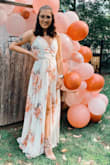 I worse this dress for our engagement party and got compliments from everyone. The dress was very comfortable and perfect for the day. The only thing I would say is it is very long, even with my heels on it was dragging, also the button is not very sturdy. I actually had to use a safety pin to keep it from popping open. Other than that the dress was gorgeous and I was SO happy with my purchase and will be wearing it again! - Katarina