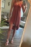 I wear this dress All. The. Time. You can dress it up or down with jewelry and shoes in my opinion. It's perfect for a date night or a brunch with friends. Super comfortable material. I love love love it. Cross straps in the back are a fun detail. Also I never wear a bra with it and it's fantastic :) - Kellyn S.
