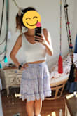I got many white crop tops but this is my fav so far. It's ribbed but it doesn't stretch out during the day. The fabric is super soft and fits nicely. - Sharon S.