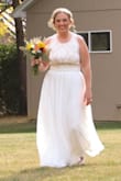 This dress was perfect for my "small wedding" when we had to change our plans due to COVID. I loved how it fit up top. The dress had three layers, and the layer closest to my body posed some issues because it was SUPER tight and kept riding up. We ended up having a seamstress friend completely cut that layer out and I bought a slip to wear underneath. Of course it was also too long, but that was to be expected. This is a great dress, but I would definitely make sure you give yourself time to have alterations done. - Christy D.