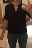 Nice quality! Fabric if better than I expected! No stretch and I like the slightly looser fit as the model appears. I have wider hips, so on me the small is slightly tighter than I would like, but I wouldn't size up! One of my favorite tops! Easy to dress up or keep casual! - Cory G.