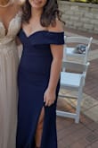 Wore this to an October wedding and it was perfect. The fabric is heavier which was perfect to make sure I didn't get too cold. I will say I was worried about the slit being a bit too much for me, but it was just the right amount revealing. I got so many compliments about the dress, including from the bride. It was super comfortable to wear too, though at 5'1, even with 3.75" heels (Alta lace-up heels), it was still several inches too long. Before I wear it again I will almost certainly get it hemmed.
In fitted clothes, I normally wear a small, but if I order this in a different color (which I may, I really loved the dress), I would probably order an XS instead of a S, the top was a little bit big so it kept flipping inside out (so the rubber bits on the edge to keep the dress up were out). If you are smaller chested like I am (30B/32A), you'll want to make sure you have a good strapless or adhesive bra, and I would go down a size, but definitely don't not get this dress because you're worried about that. - Savannah F.