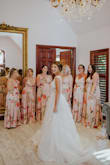 I was searching forever for floral print bridesmaid dresses to go with my wedding color theme of peach, orange, yellow, coral, etc. Not only did I have the color and print to worry about but I also had to make sure they looked good on all different body types for my girls. These dresses worked out great! The adjustable straps are super nice, the slit adds some sexiness, and the matieral is silky and great quality (not at all see through and has lining underneath). The only thing I wish it had was a clasp to hold the wrap front together - some of the bustier girls needed to pin it or get their dress sewn shut. My bridesmaids looked gorgeous though! - Sarah T.