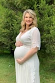 I bought this dress for maternity pictures and I absolutely loved it. I think a large would've worked, but I didn't want to chance it and the bust is too tight. It drapes beautifully and was the perfect length for me. - Alyssa B.