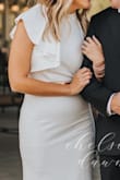I purchased this dress for an anniversary photo shoot for our 10 year anniversary. I thought about wearing my wedding dress but it felt weird to do that but I wanted something felt someone bridal but sophisticated and understated. This fit the bill perfectly. I styled it with a gold metal belt that really popped! It fit like a glove and had two layers so no seeing through this thing! Would highly recommend and got so many compliments! - Rochelle K.