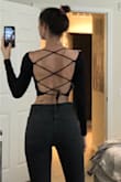 Party in the back! So cute and the material is really comfortable, kind of like a spandex feel almost. The sleeves are long (they go past the wrist if you know what I mean) which is always amazing. Dress up or down! - Juliette W.