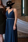 I wore this to a wedding and it is SO BEAUTIFUL. The chest was a bit tight on my bust, but sizing up would have made the dress too wide for me. It was definitely too long so I had it hemmed and we removed almost 4 inches. It was still long in my high heels! The color is stunning, the v neck cut is flattering, and it looked so much more expensive than it is! - Lily H.