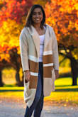 The sweater seemed very large when I took it out of the packaging but it fits me very well and it's comfortable! I love wearing it - Navika M.