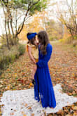 This dress is a stunner! It's super flattering and comfortable. It flows great for photos. The bright blue color is to die for as well! 

I'm typically in between medium and large when it comes to dresses. The medium probably would have worked but with my broad shoulders the large was great. If you aren't sure or are in between sizes like I am, I would err on the side of caution and size up. - Mary D.