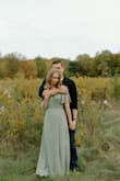 I'm obsessed wit this dress! It was so flattering in my engagement pictures and exactly what I was looking for. I saw a lot of people say it's too low cut and too long, but I found it worked pretty well with a plunge bra and ~2.5 inch wedges for me. In a perfect world, maybe a 3-inch heel, but I was in the grass for pictures and didn't want to go to high. Full disclosure, I'd have been slightly better off in an XS, but they were out of stock and it was kind of a last minute decision, so I just tied it really tight, and it worked out. - Ellen S.