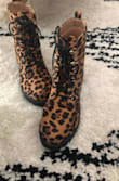 Runs large so my feet slide a little. Also very squeaky! Not sure if they need to be worn a little for that to go away. Slightly disappointed and wish I had ordered Martins instead. - Samantha B.