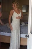 To be honest I ordered this dress and others to simply get a feel for the silhouette I wanted for my wedding dress, I had no intentions of falling in love with it and wearing it for my early Fall beach wedding. This dress turned out to be the one though! The lace looked much more expensive and high quality than I thought I'd receive for such an inexpensive wedding dress. It truly fit my vintage, barefoot in the sand, sunrise nuptials vibe. I have an athletic build, broader shoulders, small breasts, and muscular legs- the Small fit very well just a little extra care had to be taken when zipping by the ribcage so it wouldn't snag. I had a wonderful seamstress tailor the length, add cups so I didn't need a bra, I had a bustle added, and also added a lace cover to snap over the rather large zipper pull. Overall, it fit like a glove and I received a million compliments from my seamstress, my guests, and even our caterers! Most of all I could move and dance freely in it- the lining is stretchy. Highly recommended!! - Gretchen A.