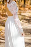 My daughter wore this for her wedding on 10/10/2020. She wanted something simple and beautiful, this was it! She wears a 4-6 so she ordered the small and it fit her perfectly! It could have been shortened but she left it long and let it touch the ground. She felt beautiful in this dress and looked it too! Thanks, Lulus for making the perfect dress for my "no frills" Daughter! - Marci F.