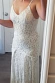 I'm a low budget bride, and I was looking for a dress that would WOW but not cost very much. I found this dress, and the medium size fits me a bit tight (quarantine weight gain, y'all - it's bad lol), so I wasn't able to get the zipper all the way over the waist seam on my own (see picture) but I AM. IN. LOVE. This dress is such good quality - a heavy lace over a thick nude slip, with a small lace train and an unnoticeable zipper in the back. My plan is to wear this dress with a tulle overlay for the ceremony for the drama, and then just this beautiful, romantic, boho-style dress for the reception. I couldn't be happier with how it all turned out! - Jenaye W.
