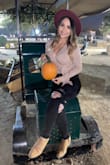 Very stylish and perfect for fall! You can definitely dress it up or down. Soft material and it is more of a crop top, which I love with high waisted jeans! You can tighten the shirt up or wear it more loose depending on the wrap you decide. The burgundy hat is also from Lulus. - Norma R.