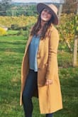 Loveee this coat. Perfect for fall and looks really classy. It fits really well but is just a little tighter on the arms so you wouldn't be able to wear a bulkier sweater with it. I bought a medium! - Jessica G.