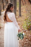 I absolutely LOVED it and got so many compliments! Like many other brides, we had to postpone our wedding but still wanted one kinda last minute! So I ordered this dress. I ordered a medium, altered the sleeves to fit my short arms and got a bit taken off the bottom! I also had them put in padding due to me having a smaller chest it fit looser. I also took it in on the top where it clasped together in the back. I recommend this dress!!! - Anna K.