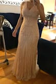 It is more beautiful than in the photos it fits me perfectly the color is gorgeous it runs large I am usually S but the XS fit me perfectly. - Ariela B.
