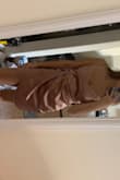 I loved the way it looks on me, and it's not too revealing so I love it!! The flap at the bottom is nice to hide my belly! - Allison M.