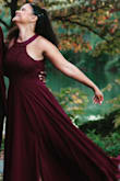 I bought this for a photo shoot turned engagement. I'm pretty short and had to go get it altered to be a lot shorter. Also the split isn't as noticeable as the image shows. I had to intentionally hike it up to emphasis the split. Other than that it was beautiful!! - Erika C.