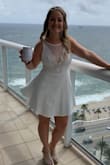 I love this dress so much -- it's demure, but has just the right amount of cleavage... and is padded/structured enough you can go without a bra. (Or at least I could!) 

Cute, flirty, and so fun!  (Sorry if the photo is blurry -- it was a snapshot off a boomerang!) - Karli M.