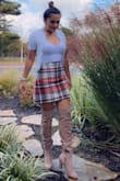 I have ordered a couple of plaid skirts from Lulus and have not found one that fits me properly. Until now that I ordered this one and it fits like a glove. I love it. The others make my behind flat. This one gives me shape. I would recommend it. - Azucena U.
