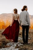 I ordered this dress for my fall engagement photo shoot. My photographer LOVED it, and so did I. I ordered the dress 5 days before our shoot, and basically wore this right out of the package after a bit of ironing. The color is a beautiful cool-burgundy, just what I expected from a "wine" red dress. The dress itself is very comfortable, heavier than I expected, but that was a good thing as the material hung and drooped so nicely. And the fabric is thick enough (and the front seams in the exact right spot) that I didn't have to wear a bra. It was almost the right length for me at 5'3" wearing 4-inch heels. I'll definitely hem it a few inches before I wear it anywhere that requires walking in a sophisticated manner (aka, not bundling it up around my knees). This dress is a winner for sure, and I'm excited to wear it again and again. - Liesl G.