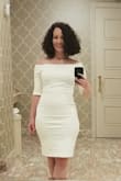 I loved the dress. It was a bit tight but for me because I am fuller through the hips but not up top. I am on the fence about up sizing. I had to adjust a lot to keep from riding up. Seamless, slimming undergarments are a must esp. With the white. - Jenny M.