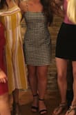 I love this dress! I wore it with heels to go out on my birthday and I wear it with sneakers/sandals for a more casual look. Just so cute for so many different occasions. The skirt isn't super fitted on me but that makes it more comfortable in my opinion. It is short but not so much that it bothers me, just be careful bending over, etc. - Madison F.