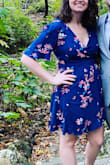 I bought a size large in this dress when normally I'd get a size medium. Based on other reviews, I thought sizing up was a better bet, but I really probably could've done with a medium. That said, it didn't matter too much with this being a wrap dress as I was able to adjust the waist to my size. This was perfect for the warm fall wedding I attended! I was worried about the neckline falling as the night wore on, but I actually did not have to pin or readjust at all throughout the night. - Kassidy P.