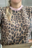 It is a really cute shirt. The material is soft and it looks a elegant print. - Paloma A.