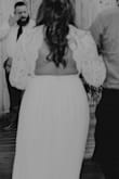 After we postponed our wedding due to covid, we decided to elope but didn't want to wear our fancy outfits just yet. This was the first and only dress I purchased for our day and it was PERFECT. I had it altered (hemmed, waist pulled up a little and top of it pulled up a lot as it was baggy on my top half.) I wore a sticky bra and it was perfect, I got so many compliments and it was comfortable for the whole night even eating dinner. Highly recommend this dress! - Abbi A.