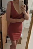 I originally bought a size S but it ran a little too big, especially at the hips so I exchanged it for an XS. XS was a good fit but one of the straps was sewn on weird so I ended up returning it. It definitely is low cut with a lot more room for a bigger bust. - Kat C.