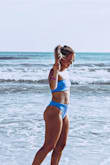 I bought this swim suit for a mini vaca for a destination wedding. I love it so much! The bottoms and top fit perfectly and I liked that the top had more coverage. Absolutely beautiful color and super comfortable and soft. I'd definitely buy another one for my next vaca! - Jessica G.