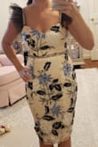 I bought XS.... I love this dress! It looks exactly as pictured. I will say when I took it out of the bag I wasn't sure I was going to like it on me but once it was on... obsessed! Very flattering.. the tulle on the straps give it an extra sexy look... LOVE! - Valerie D.
