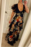 This is the CUTEST DRESS EVER! I love everything about it. Amazingly flattering in the waist, and the flutter sleeves are so pretty. I was worried the flounces would be too much going on, especially since I'm on the shorter side, but they were perfect. I know it sounds silly to say I'm really, really sad about a dress, especially with everything going on in the world right now, but I'm super sad that I can't wear this because my chest is way, way, too big to fit in the dress. They're out there, obscenely too much, and if I would order a size up, it would be too big around the waist and now look the same. It didn't seem this low plunging in the photo, but the model isn't big busted at all. Super duper bummer!!! This dress is gorgeous, and I'm envious of smaller chested girls who could wear this. - Joanna M.
