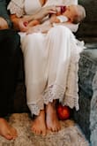 Bought this dress for our newborn photo session. Fair warning, I was unable to complete zip up the back of the dress at the current weight, but worked out perfect for pictures taken from the front. Really beautiful detail. - Krysta B.