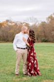 This dress is absolutely beautiful! I just wore it for our engagement photos and it was the perfect pop of fall color. I will say the dress is pretty long for someone who isn't the biggest fan of heels, but I made it work. - Liesel M.