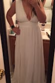 Purchased this dress for a destination wedding (the wedding was canceled due to COVID so I don't have any wedding pictures). The dress was beautiful, very low cut so would definitely need to add cups and maybe some sort of closure to keep from spilling out. The open back was unique and pretty and the cut around the armpit is very deep as well, but if cups are added to the bust and/or tape is used it shouldn't be an issue. Very, very long but I am super short so I had figured it would need to have it hemmed. - Ilissa F.